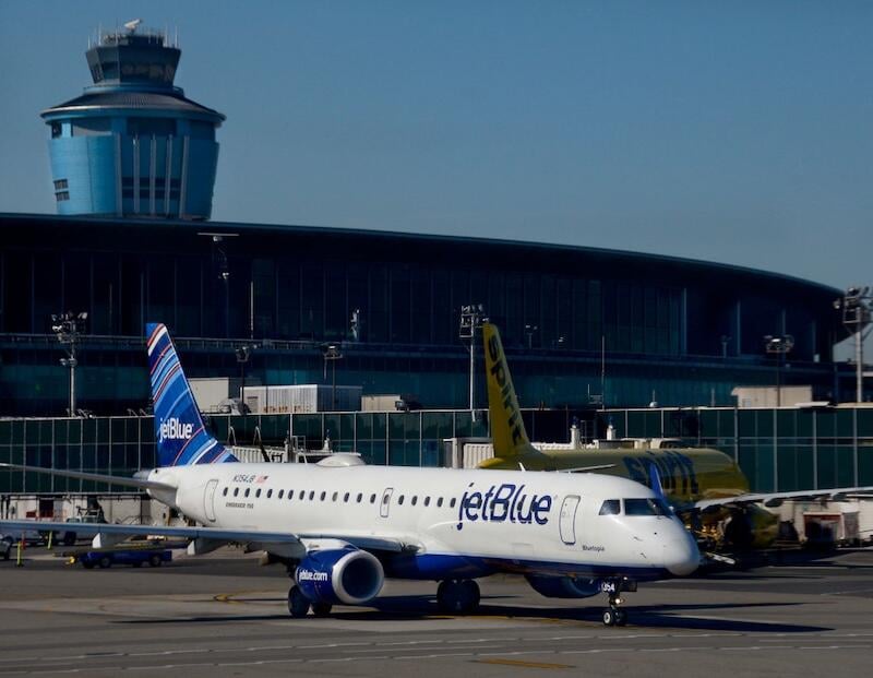 jetblue aircraft taxis at laguardia airport 