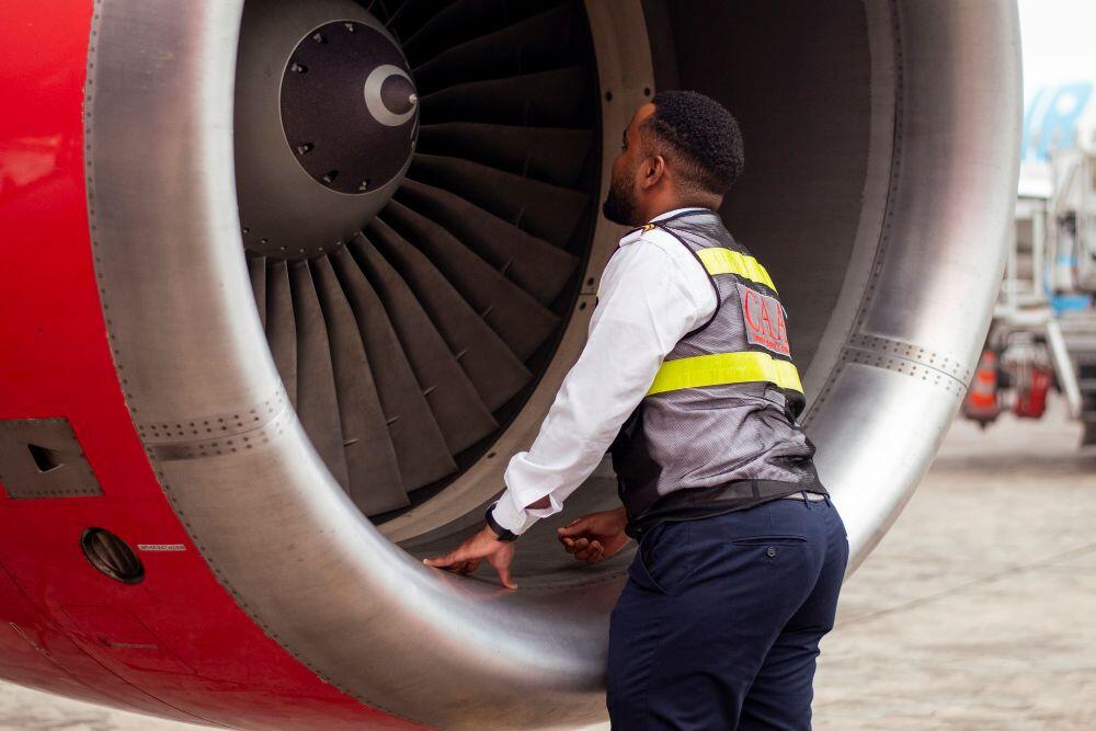 Man looking into jet intake