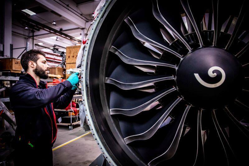 TAP M&E technician works on an engine