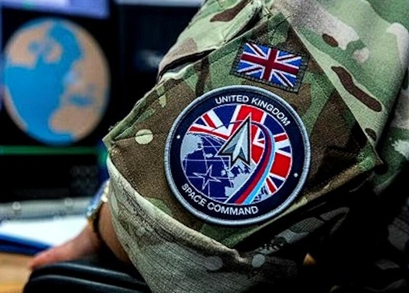 close-up of military camouflage uniform bearing uk space command patch