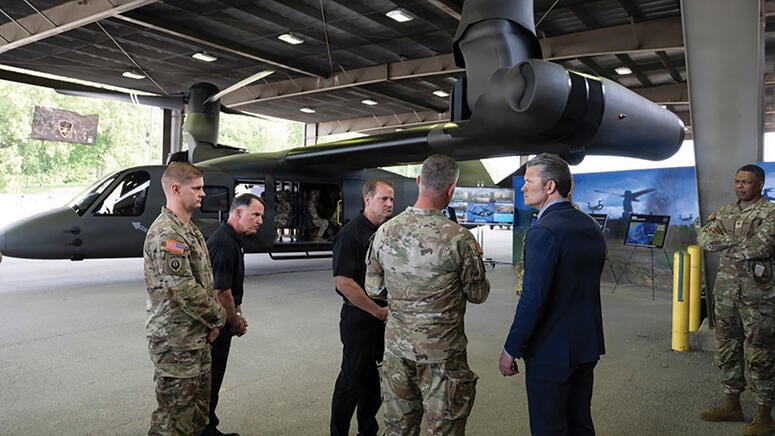 Pete Hegseth with soldiers by MV-75 mockup