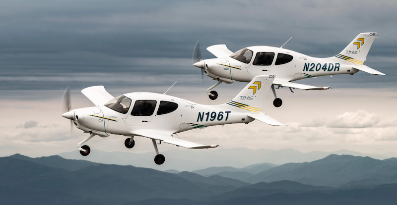 two cirrus trac10 aircraft in flight
