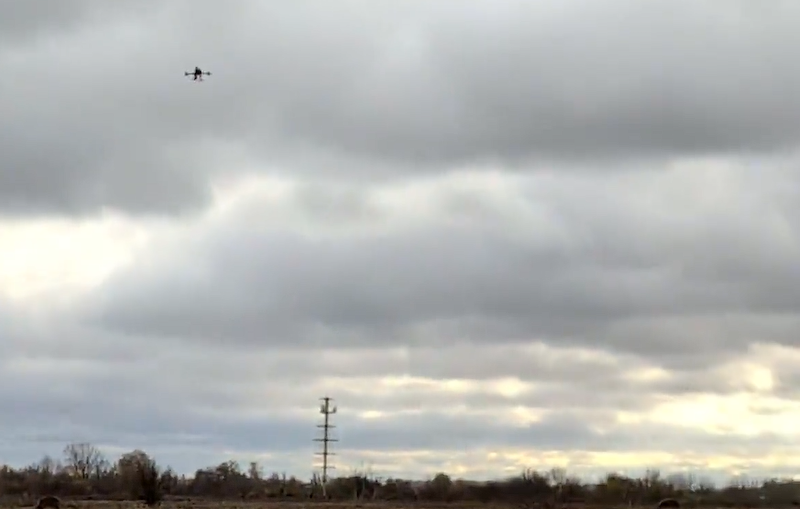 landscape featuring drone flying in cloudy sky