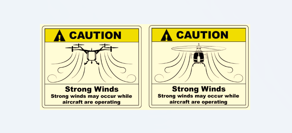 Examples of downwash/outwash caution area signage in the FAA's design guidance for heliports and vertiports.  Credit: FAA