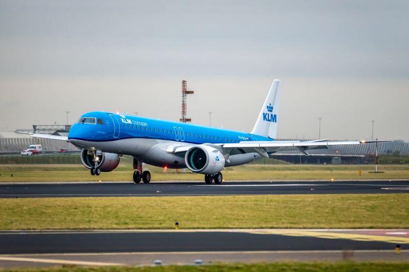 A KLM Cityhopper E195-E2 landing at Schiphol Airport. 