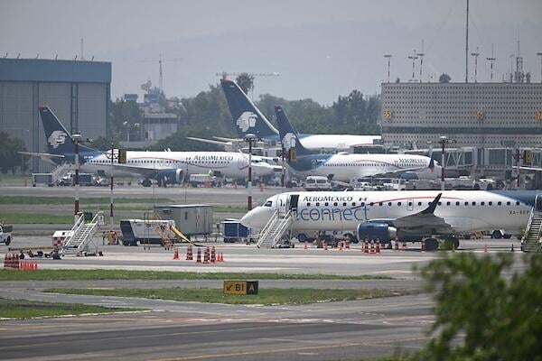 Aircraft on tarmac at Mexico City 's Benito Juarez International Airport