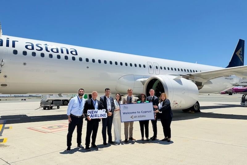 hermes airports and air astana representatives in front of aircraft
