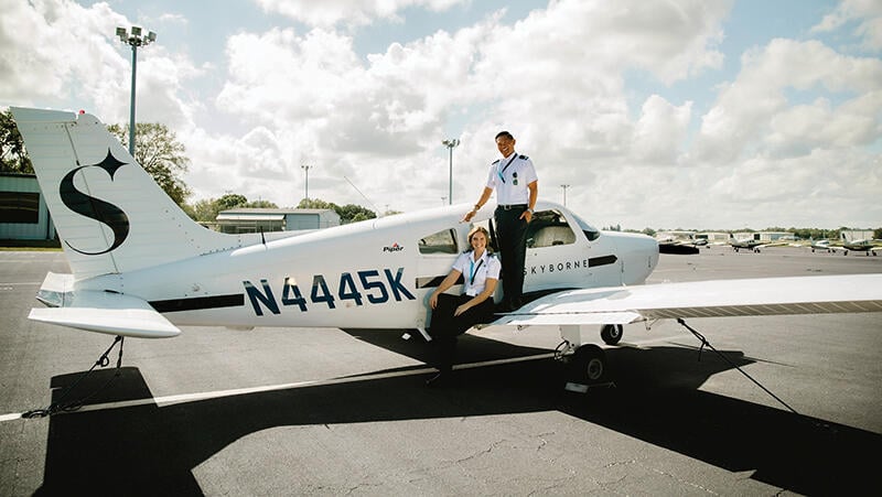 Skyborne Airline Academy Piper training aircraft with flight trainees