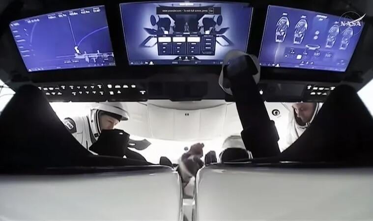 monitors and crew in spacecraft