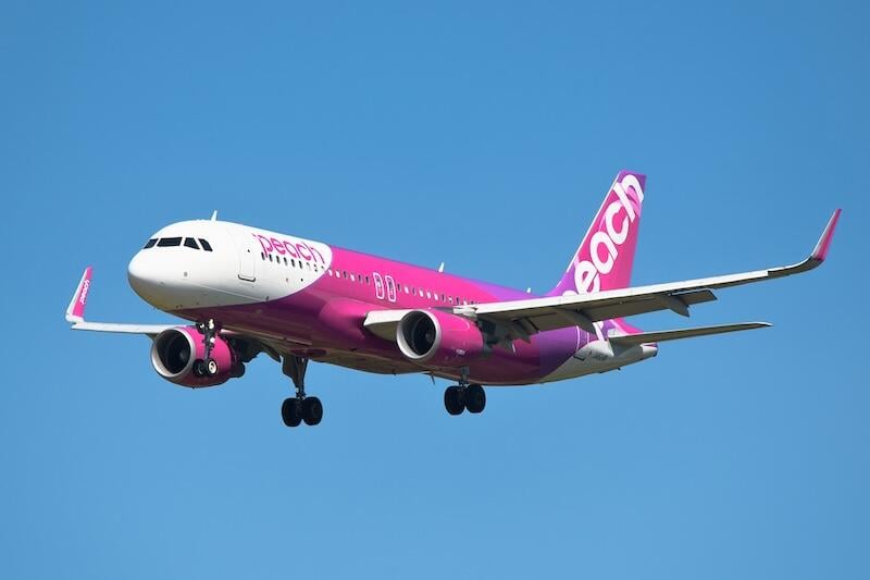 peach airbus a320-200 in flight