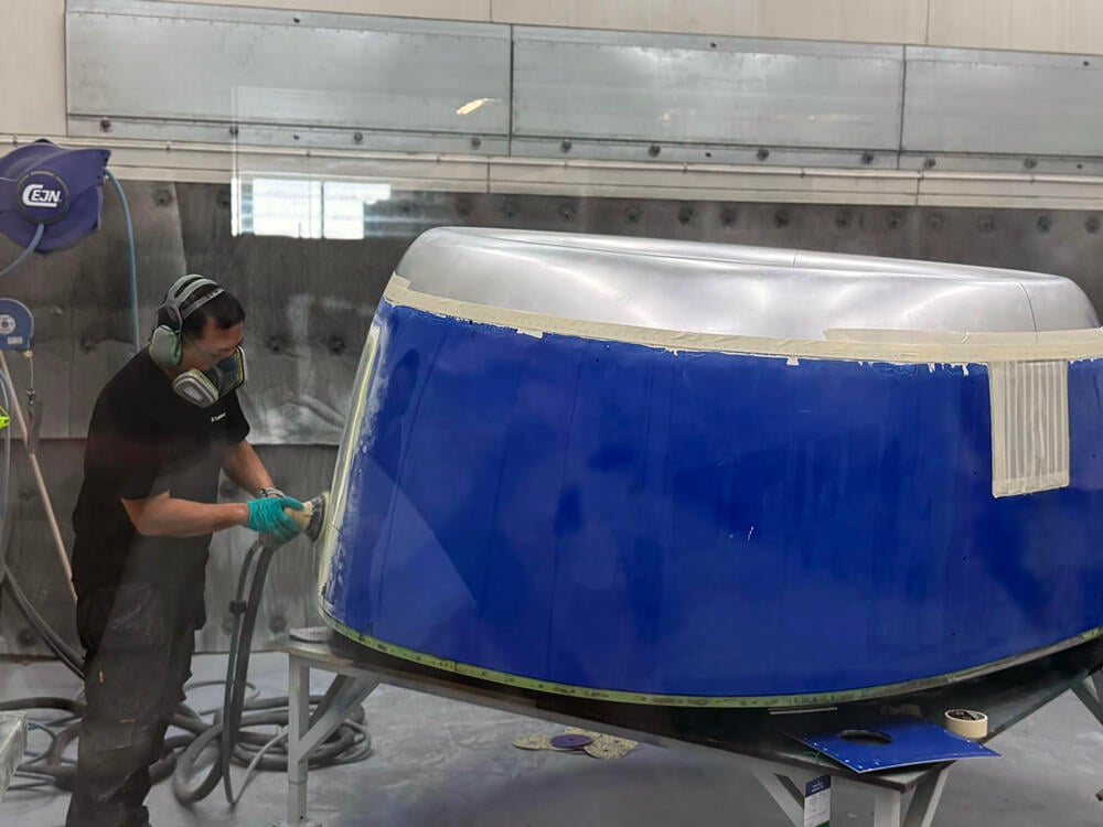 Technician working on a nacelle