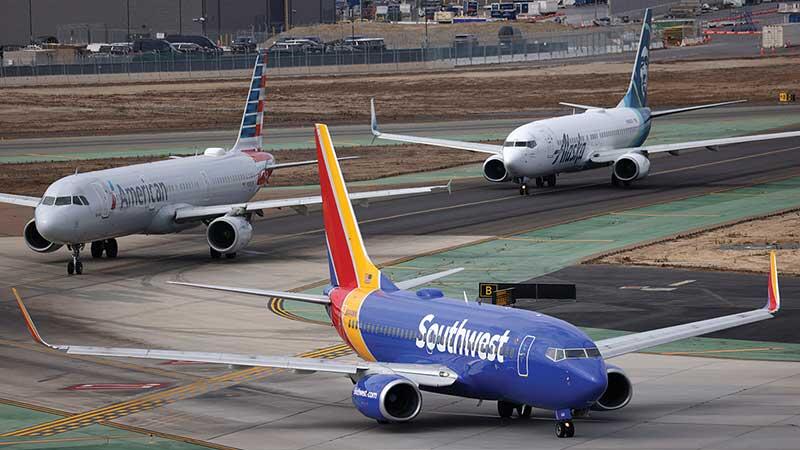 Southwest Airlines, American Airlines and Alaska Airlines jets taxiing