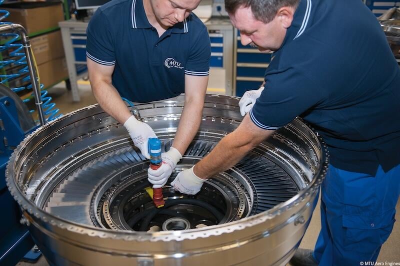 technicians working on the v2500 engine