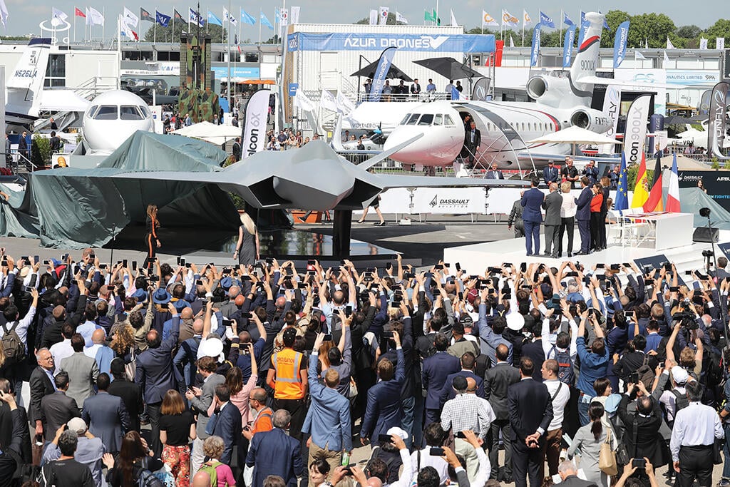 crowd taking photos of aircraft model