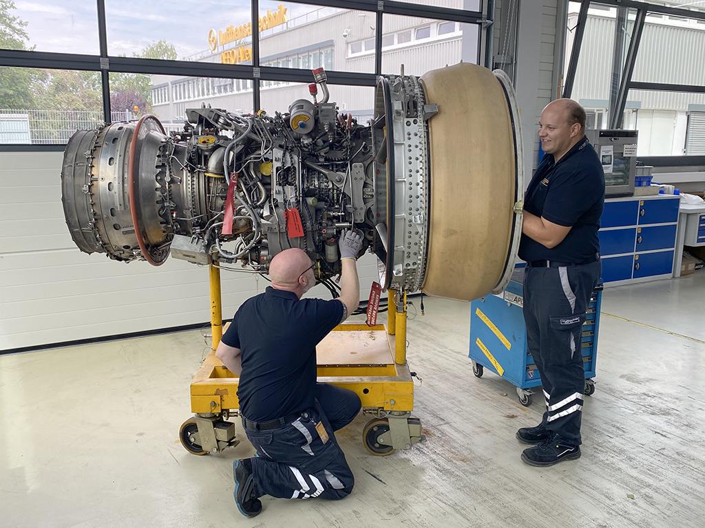 mro technicians working on an aircraft engine