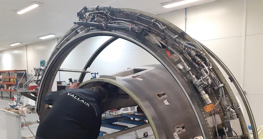 Vallair technician working on engine nacelle