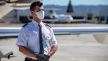 private pilot on tarmac wearing mask and gloves