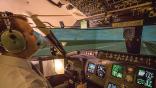 pilot at flight deck controls