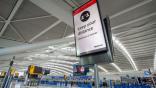 Heathrow Airport keep distance sign 
