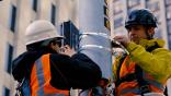 AT&T technicians install a 5G antenna system