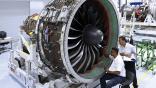 aircraft technicians working on geared turbofan engine