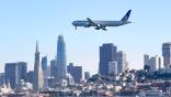 united airlines jet over San Francisco