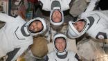 Four Expedition 69 flight engineers aboard the International Space Station