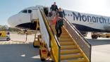 monarch airlines jet passengers disembarking
