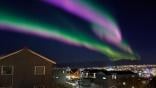 Tromsø, Norway with aurora borealis overhead