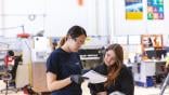 female technicians reviewing a document