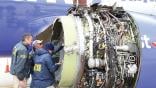 NTSB investigators look at damaged engine