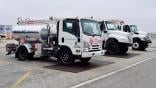 Three parked refueling trucks