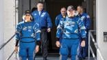 NASA astronauts walk toward camera