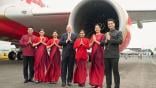 Air India CEO Campbell Wilson and crew members standing in front of an Air India aircraft