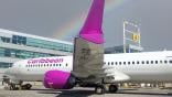 caribbean airlines jet with rainbow in background