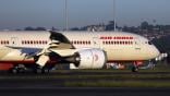 An Air India Boeing 787 taxiing on a runway at Sydney Airport.