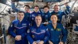 The seven-member Expedition 73 crew gathers for a portrait inside the International Space Station's Kibo laboratory module. In the front row from left are, Roscosmos cosmonauts Alexey Zubritsky and Sergey Ryzhikov, station Flight Engineer and Commander respectively, and NASA Flight Engineer Jonny Kim. In the back row are, Flight Engineers Kimiya Yui of JAXA (Japan Aerospace Exploration Agency) Oleg Platonov of Roscosmos, and Zena Cardman and Mike Fincke, both from NASA.