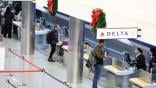 travelers at the Delta counter at Baltimore Airport