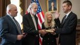U.S. District Judge Timothy Kelly, left, swears in Jared Isaacman, right, as the 15th administrator of NASA, as Isaacman’s parents, Donald and Sandra Marie, join on Dec. 18, 2025, at the Eisenhower Executive Office Building in Washington. Credit: NASA/Bill Ingalls