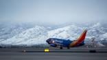 Southwest Airlines aircraft with mountains in background