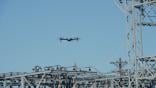 An American-made Skydio X10 drone inspects utility lines.