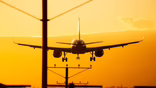 Aircraft landing and a sunset