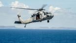  MH-60R Seahawk helicopter from the Saberhawks of Helicopter Maritime Strike Squadron (HSM) 77 prepares to land on the aircraft carrier USS George Washington (CVN 73) after delivering fresh water to the Republic of the Philippines in support of Operatio Contributor: MixPix