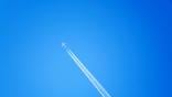 jet airliner with contrail