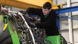 aircraft technician working on engine