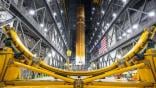 A crane lifts to vertical the Space Launch System Moon rocket for Artemis II on Saturday, March 22, 2025, inside the Vehicle Assembly Building at NASA’s Kennedy Space Center. NASA/Frank Michaux