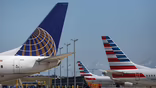 tails of United Airlines and American Airlines aircraft at airport