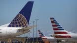 tails of United Airlines and American Airlines aircraft at airport