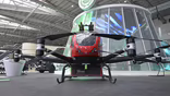 an adapted Chinese Ehang eVTOL aircraft equipped to fight urban blazes from above