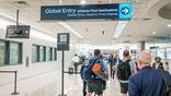 Global entry sign with travelers at Hartsfield-Jackson Atlanta Airport